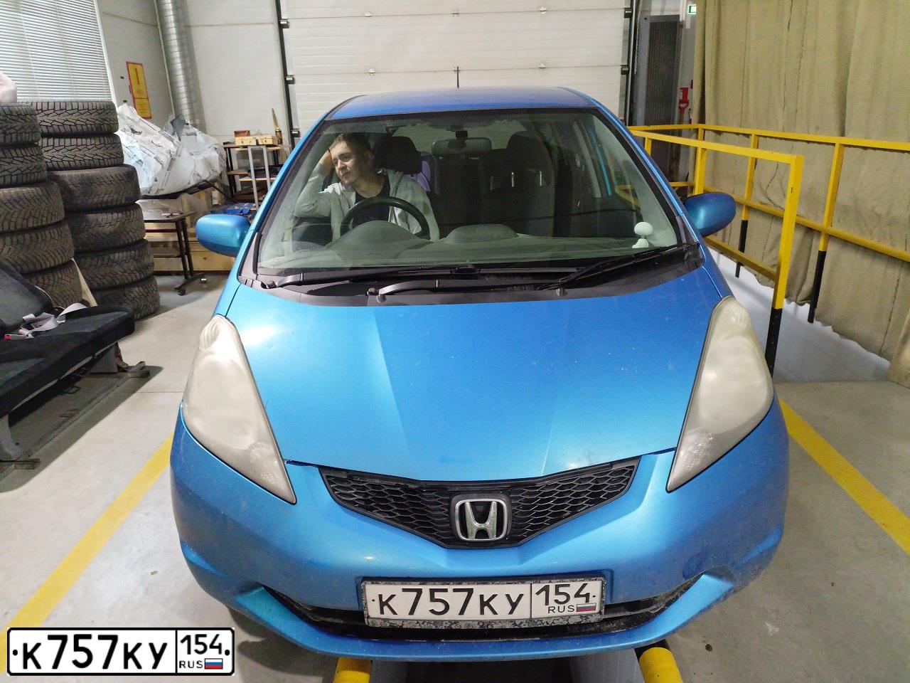 Фото автомобиля HONDA FIT, 2009 — госномер Н161ТХ70