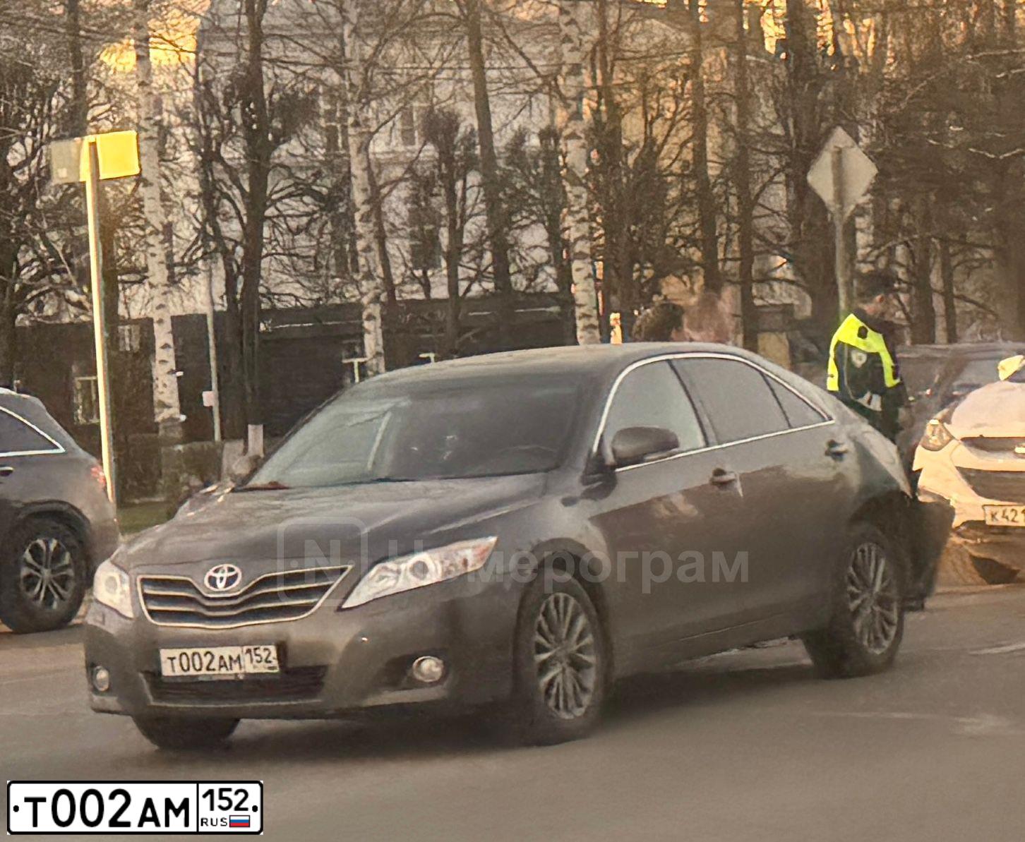 Фото автомобиля LADA 2190 GRANTA, 2016 — госномер Т002АМ152. Цвет: ТЕМНО-ВИШНЕВЫЙ