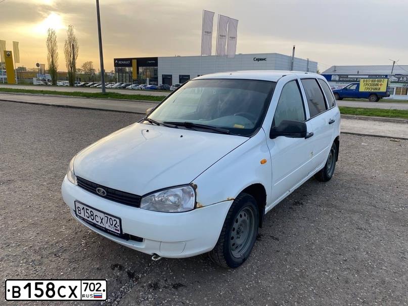 Фото автомобиля LADA 1117 KALINA, 2012 — госномер В158СХ702. Цвет: Белый