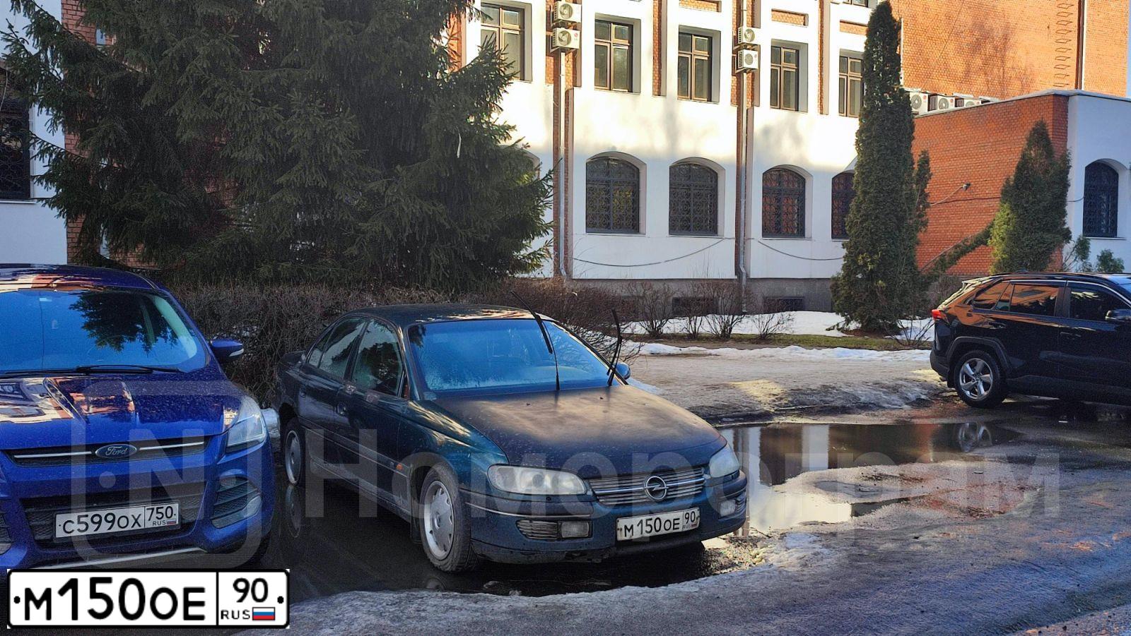 Фото автомобиля OPEL OMEGA, 1997 — госномер М150ОЕ90. Цвет: ЗЕЛЕНЫЙ