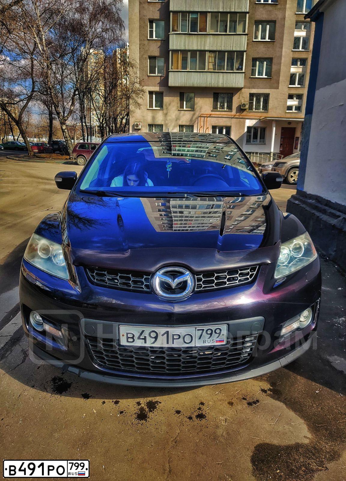 Фото автомобиля MAZDA CX-7, 2008 — госномер У999ТК190. Цвет: ТЕМНО-ВЕШНЕВЫЙ