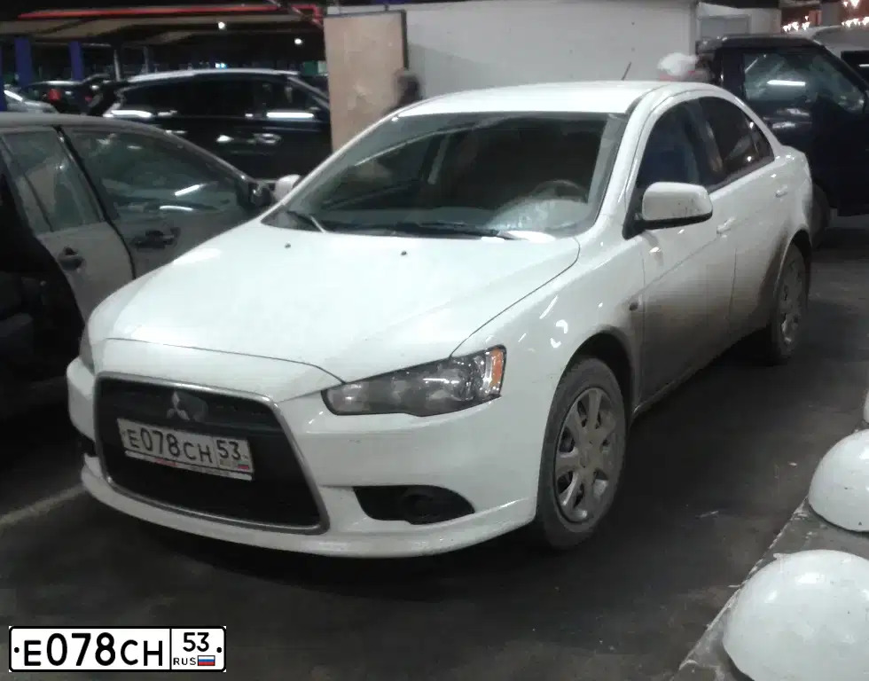 Фото автомобиля MITSUBISHI LANCER, 2014 — госномер Е078СН53. Цвет: БЕЛЫЙ