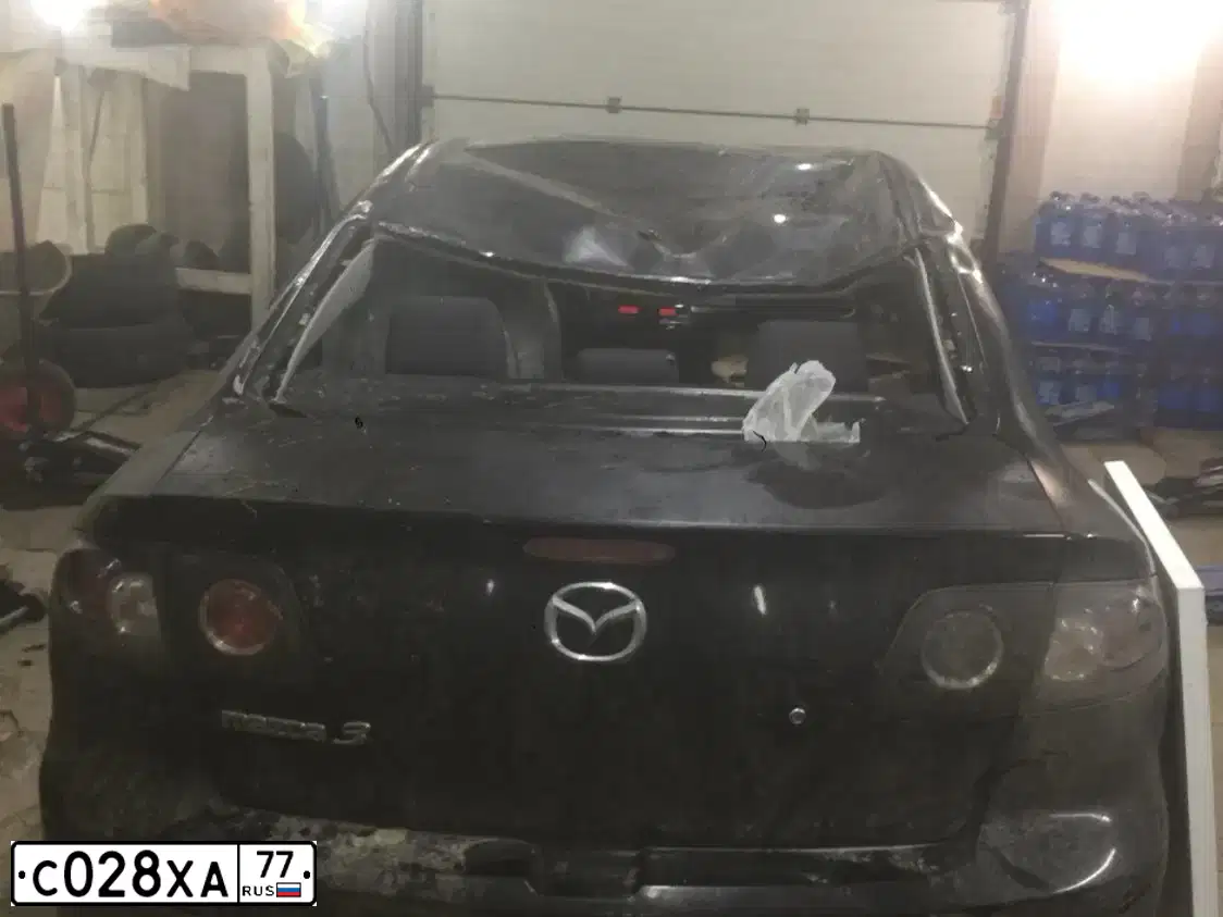Фото автомобиля MAZDA 3, 2008 — госномер Н177ЕТ199. Цвет: ЧЕРНЫЙ