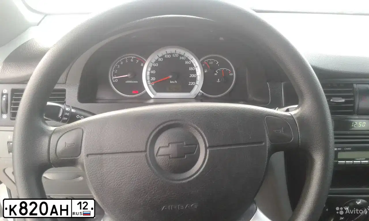 Фото автомобиля CHEVROLET LACETTI, 2007 — госномер Е511УЕ21. Цвет: серебристый