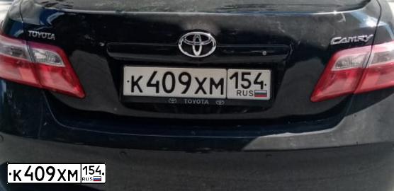 Фото автомобиля TOYOTA CAMRY, 2010 — госномер К409ХМ154. Цвет: ЧЕРНЫЙ