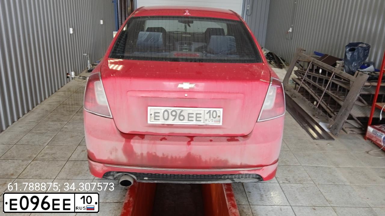 Фото автомобиля LADA 1118 KALINA, 2006 — госномер Е096ЕЕ10. Цвет: СЕРЕБРИСТО-КРАСНЫЙ