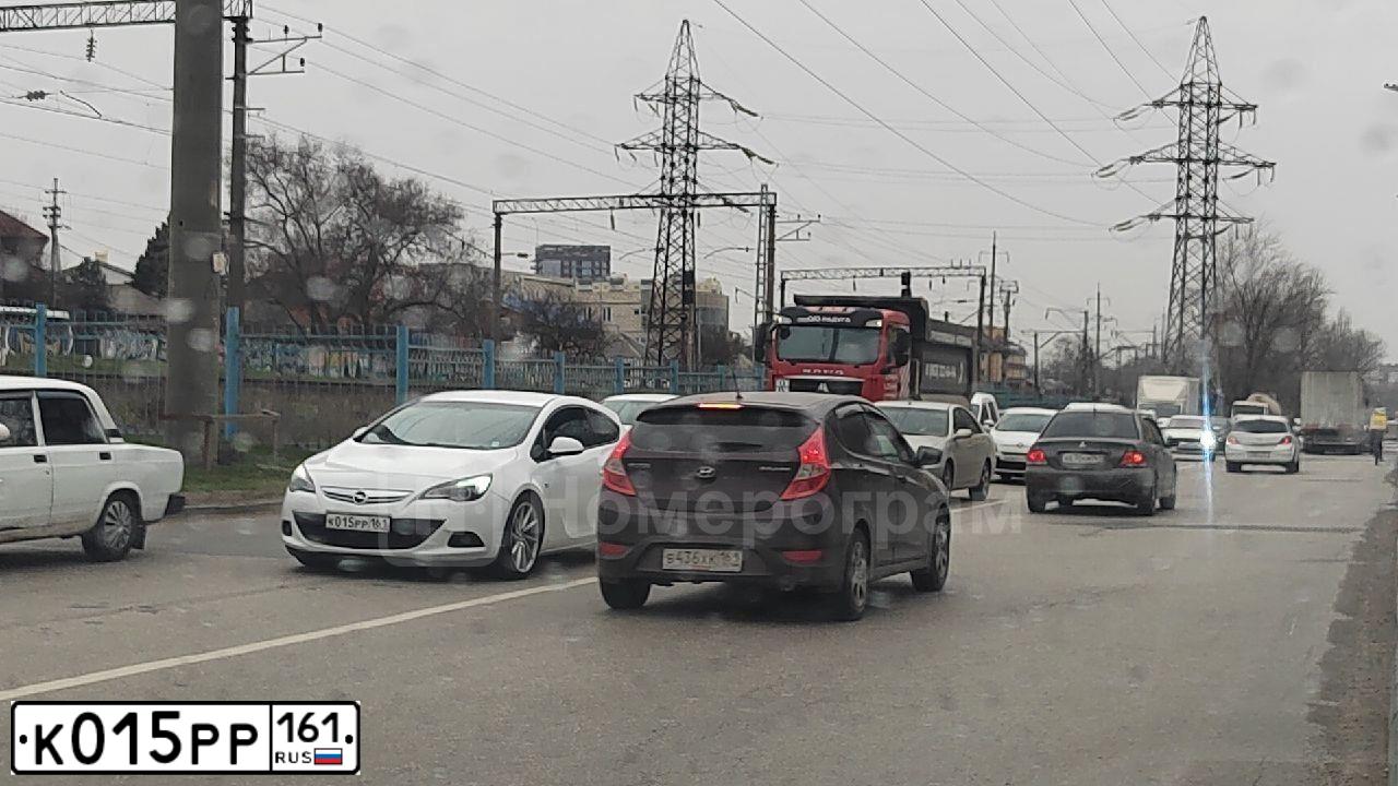 Фото автомобиля OPEL ASTRA, 2013 — госномер К015РР161. Цвет: БЕЛЫЙ