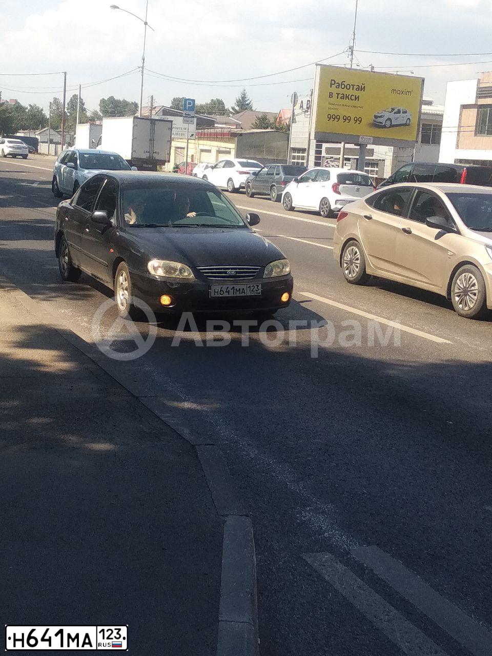 Фото автомобиля KIA SPECTRA, 2008 — госномер Н641МА123. Цвет: ЧЕРНЫЙ