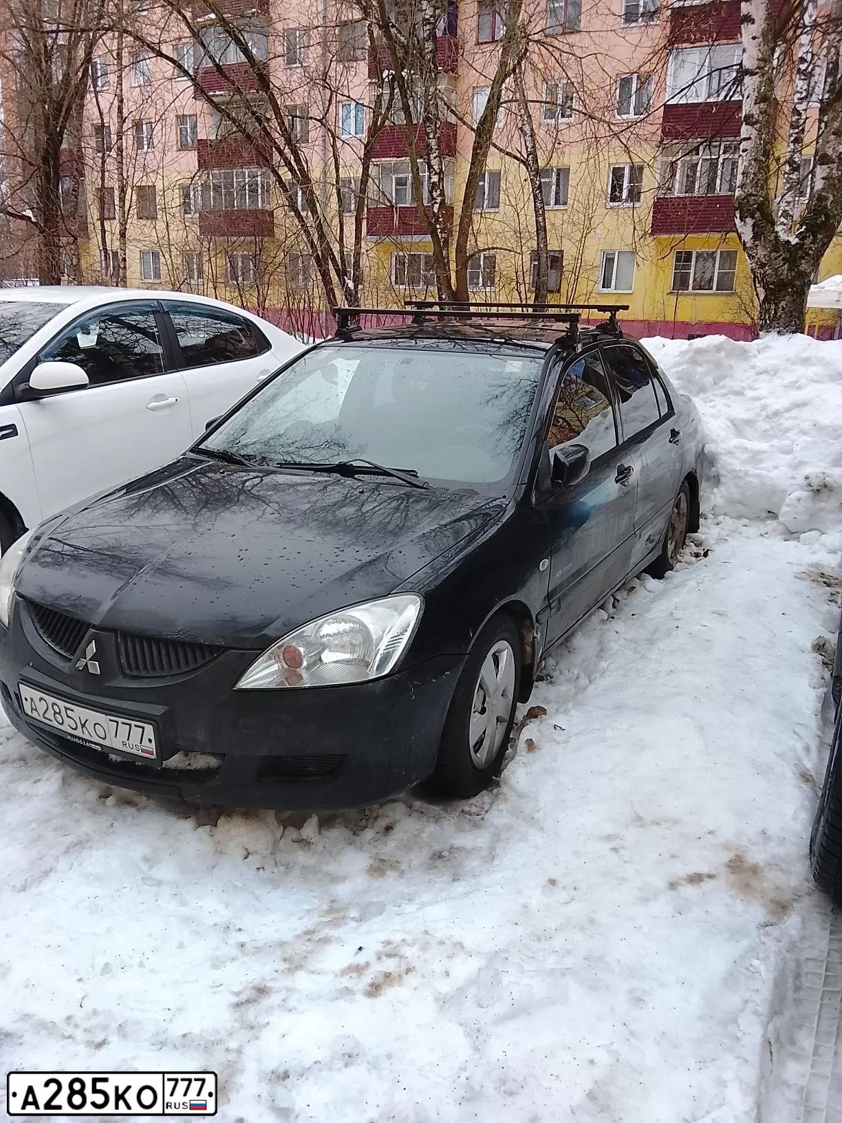 Фото автомобиля MITSUBISHI LANCER, 2005 — госномер А285КО777. Цвет: ЧЕРНЫЙ