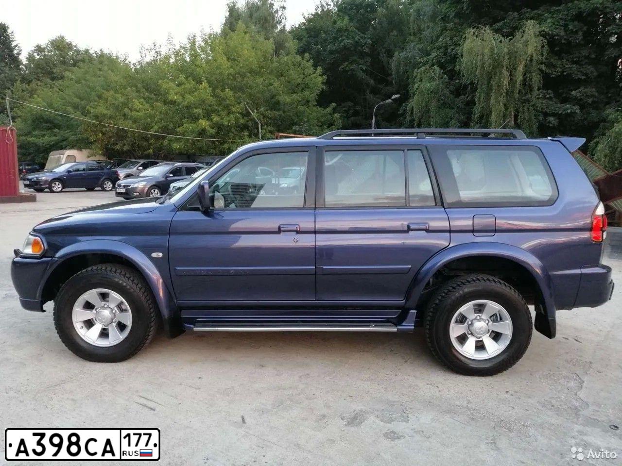 Фото автомобиля MITSUBISHI PAJERO SPORT, 2007 — госномер Н876АА702. Цвет: синий