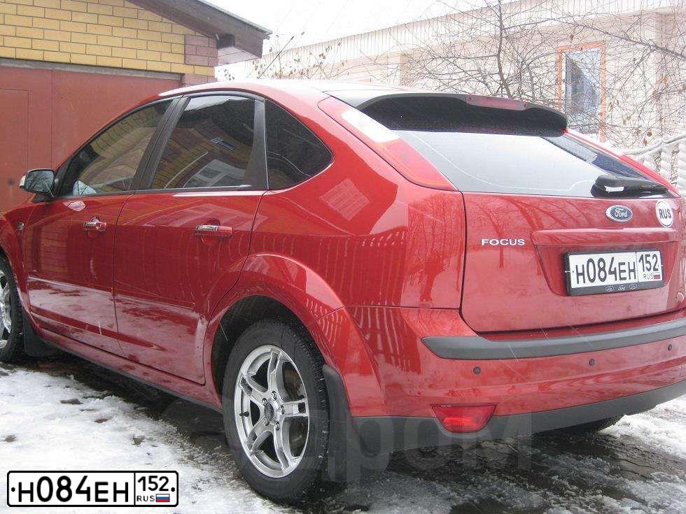 Фото автомобиля FORD FOCUS, 2007 — госномер Т004НК52. Цвет: КРАСНО-ОРАНЖЕВЫЙ