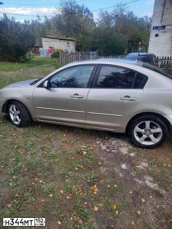 Фото автомобиля MAZDA 3, 2004 — госномер Х040КМ52. Цвет: СВЕТЛО-БЕЖЕВЫЙ