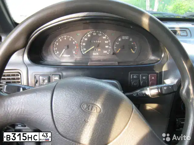 Фото автомобиля KIA SPORTAGE, 1995 — госномер Т326ОУ43. Цвет: синий