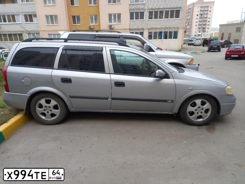 Фото автомобиля OPEL ASTRA, 2001 — госномер К677КЕ164. Цвет: Серебристый