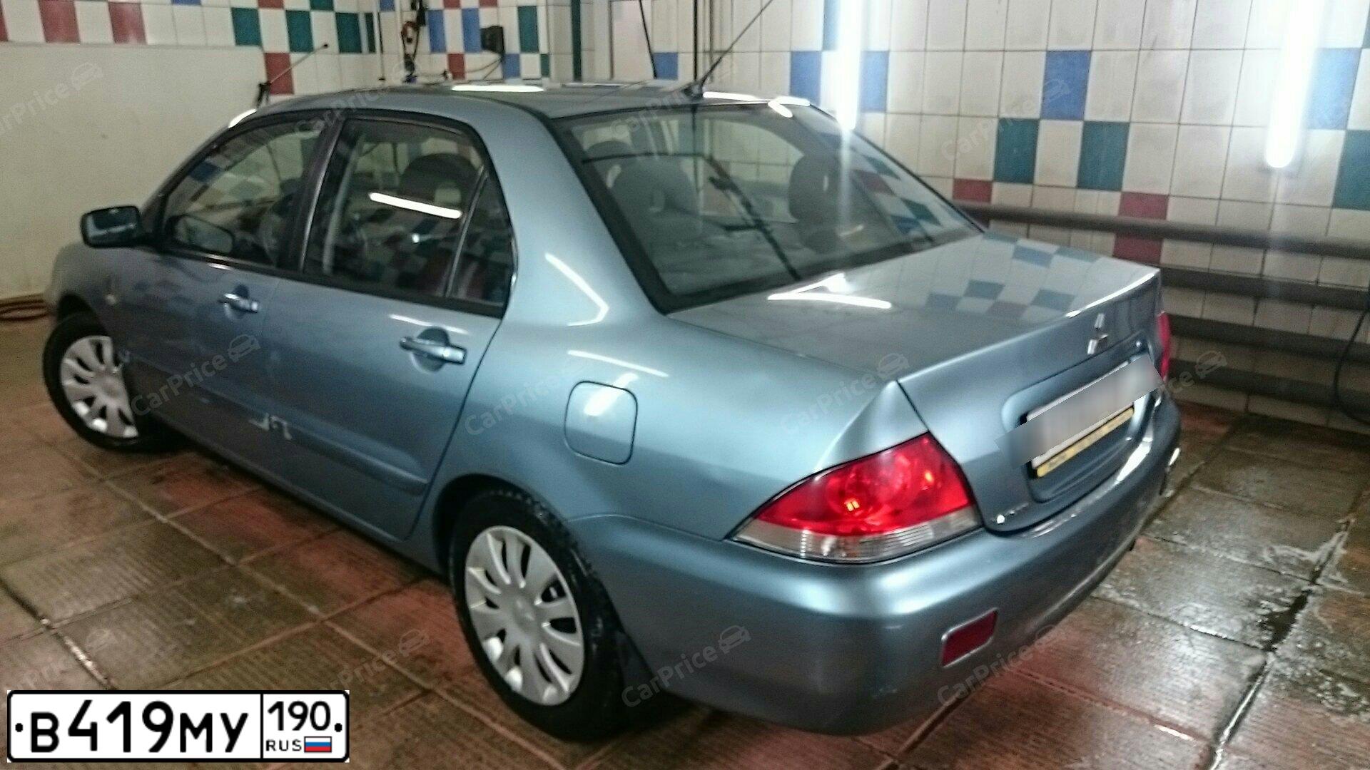 Фото автомобиля MITSUBISHI LANCER, 2009 — госномер С348ХР123. Цвет: СВЕТЛО СЕРО-ЗЕЛЕНЫЙ