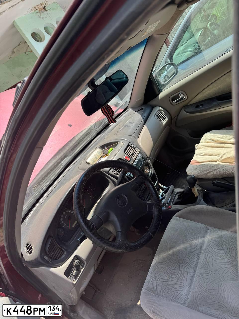 Фото автомобиля NISSAN ALMERA, 2000 — госномер К448РМ134. Цвет: Красный
