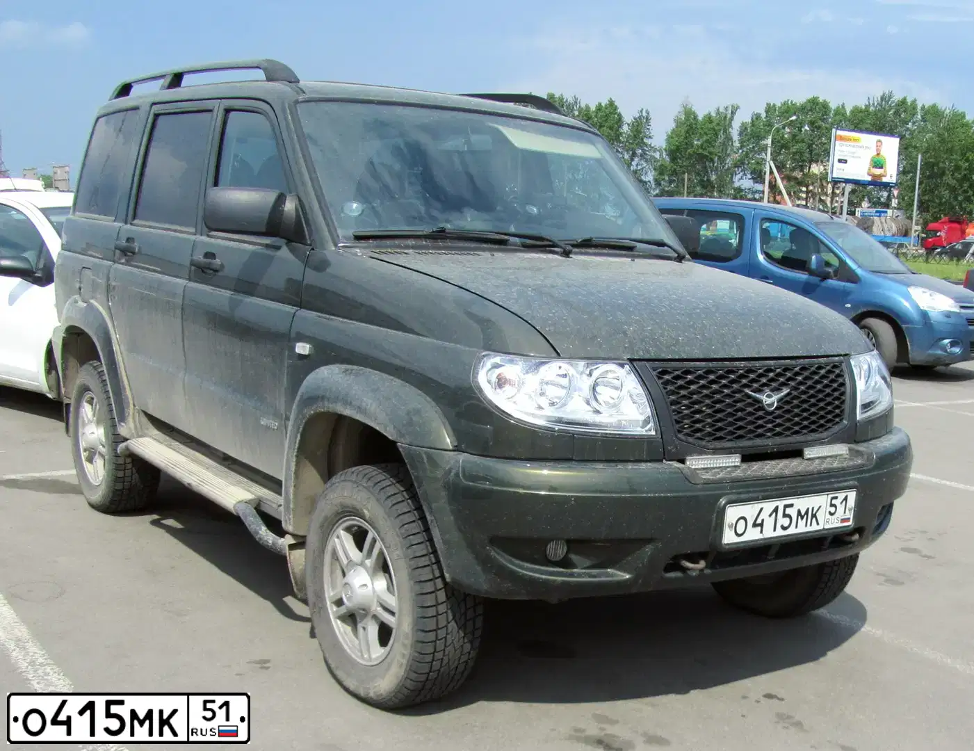 Фото автомобиля UAZ 3163 PATRIOT, 2012 — госномер О415МК51. Цвет: ЗЕЛЕНЫЙ