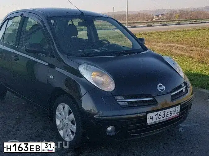 Фото автомобиля NISSAN MICRA, 2006 — госномер О554ХН31. Цвет: ЧЕРНЫЙ
