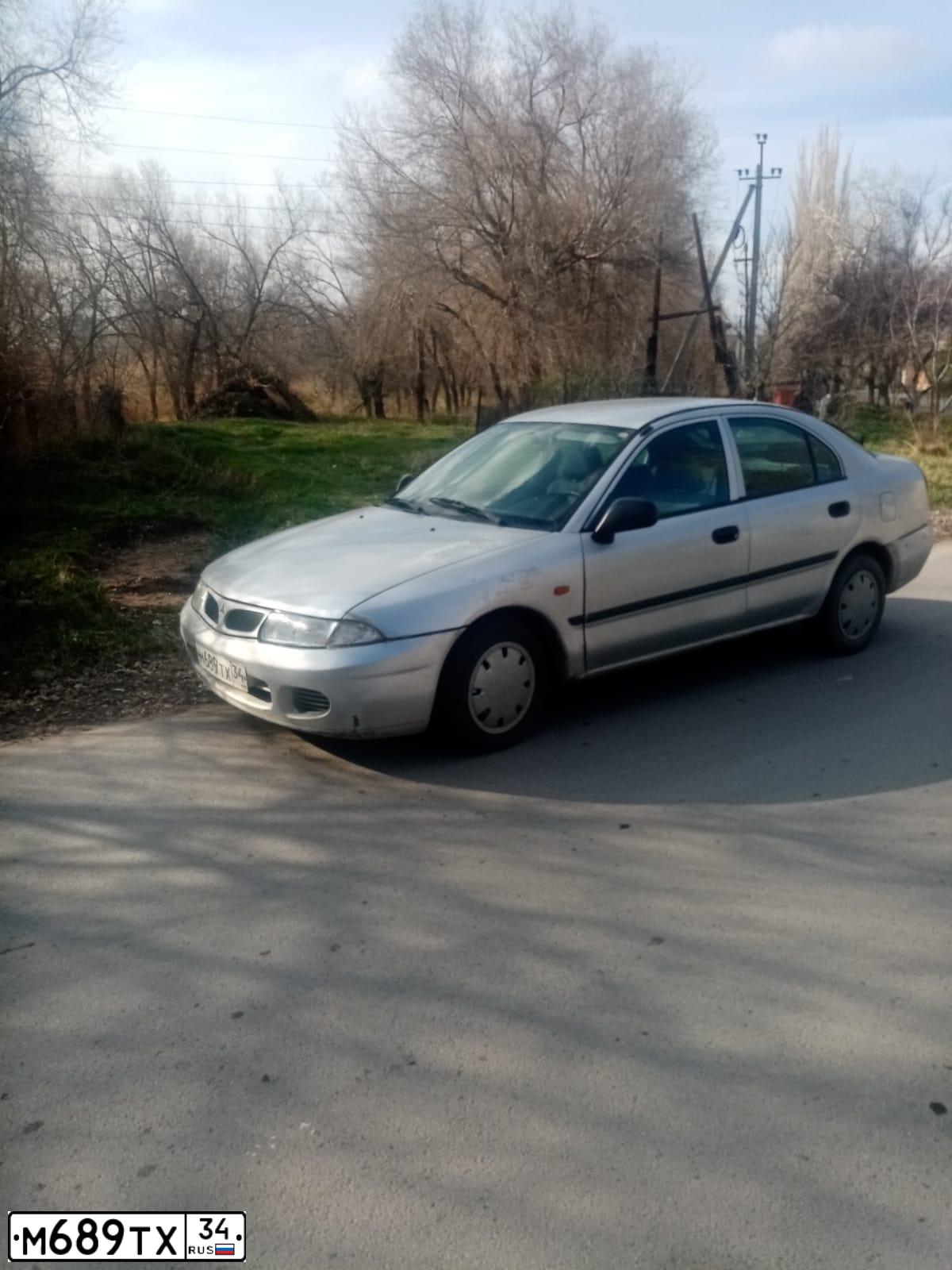 Фото автомобиля MITSUBISHI CARISMA, 1998 — госномер М689ТХ34. Цвет: СЕРЕБРИСТЫЙ