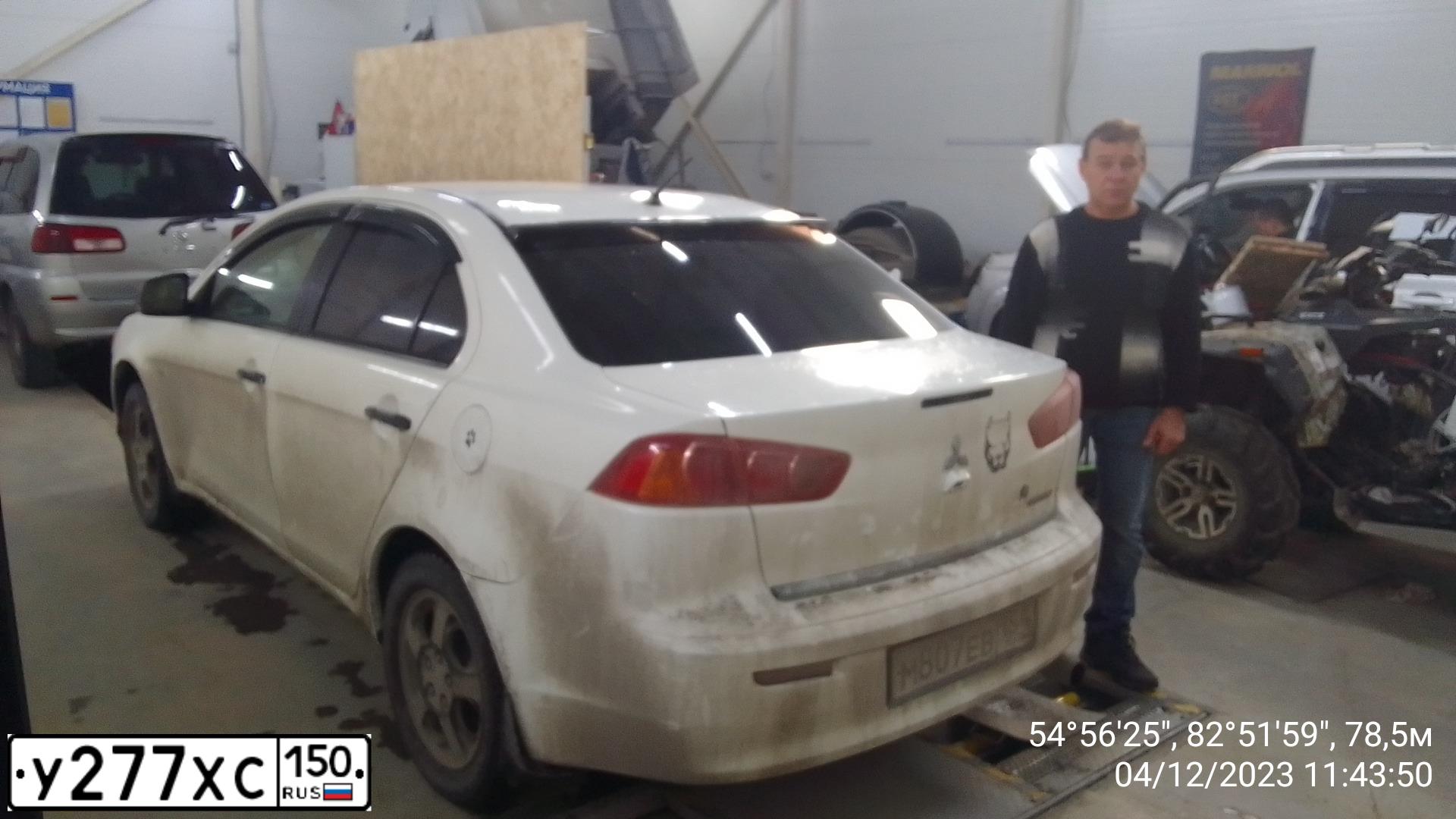 Фото автомобиля MITSUBISHI LANCER, 2008 — госномер Р501ОХ70. Цвет: Белый
