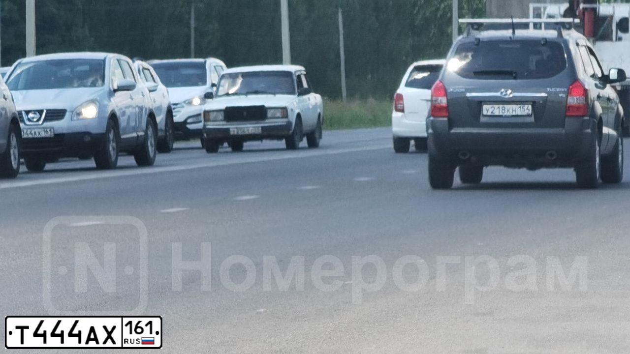 Фото автомобиля KAMAZ 53215 /6X4/, 2008 — госномер Е238АУ761. Цвет: Оранжевый