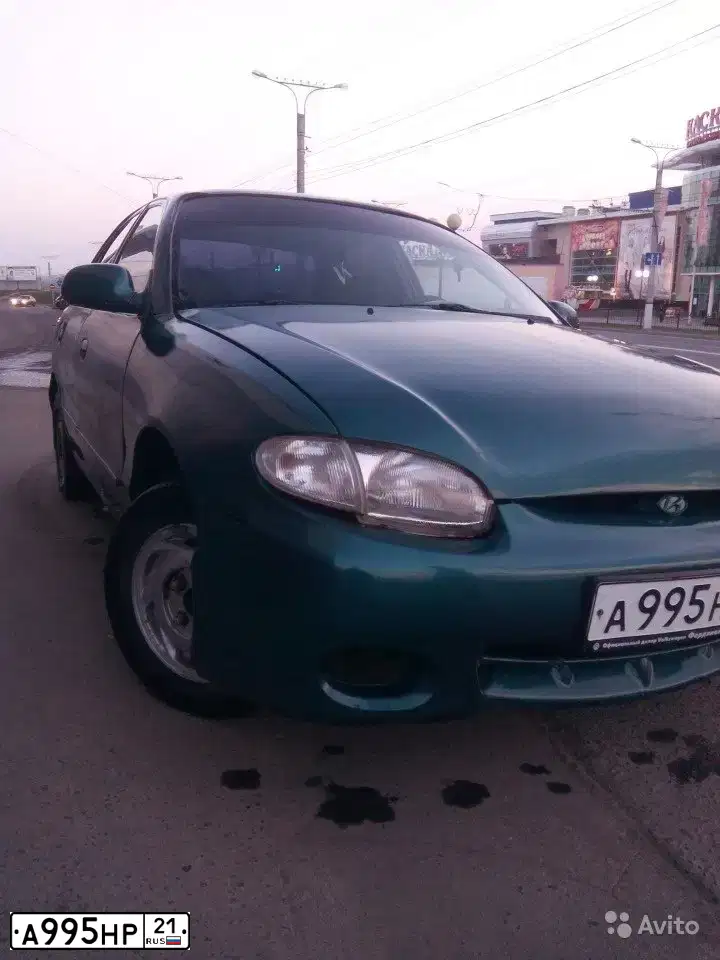 Фото автомобиля LADA 1117 KALINA, 2009 — госномер А955НР21. Цвет: ТЕМНО-СЕРЫЙ