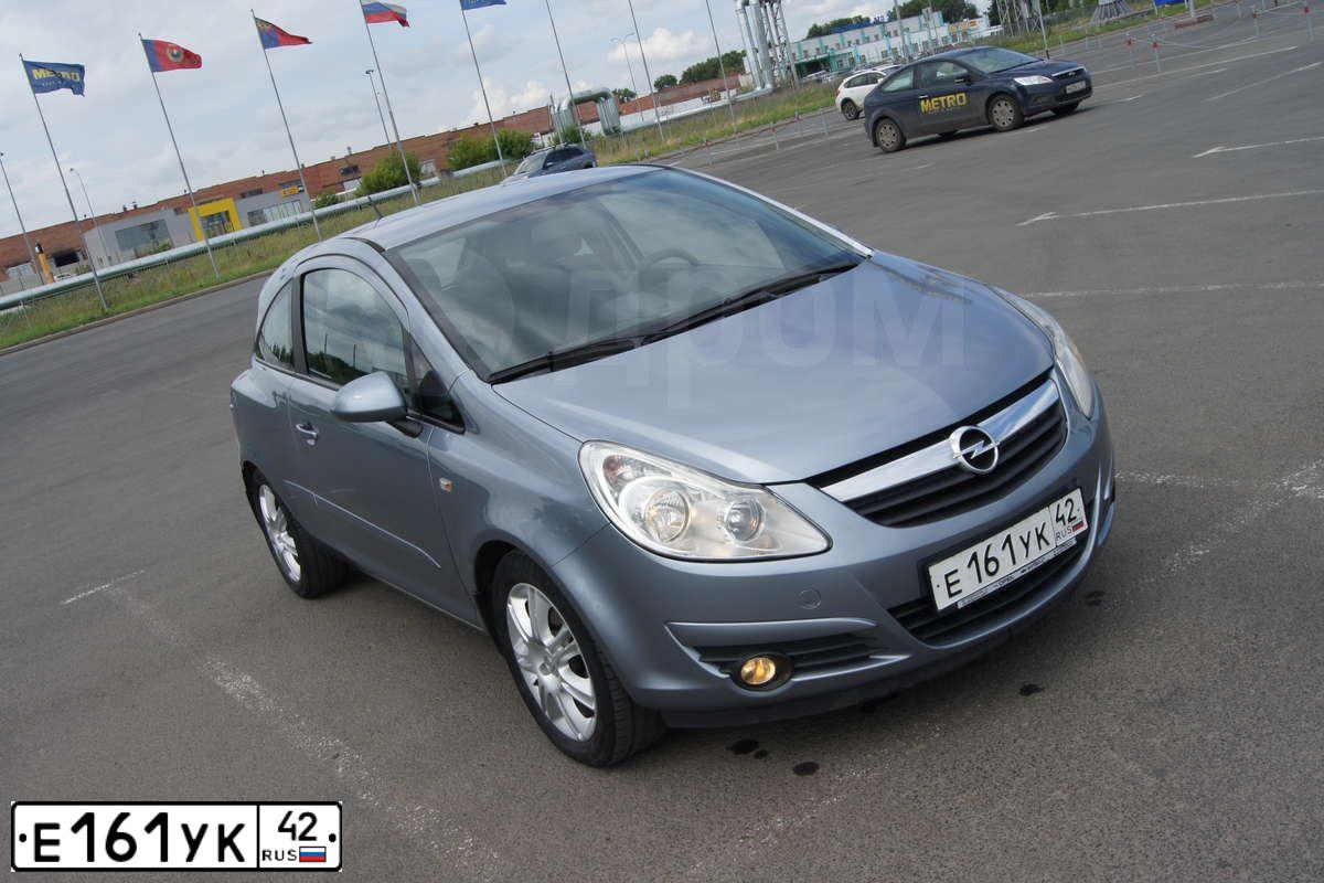 Фото автомобиля OPEL CORSA, 2007 — госномер К581РР154. Цвет: СЕРЫЙ