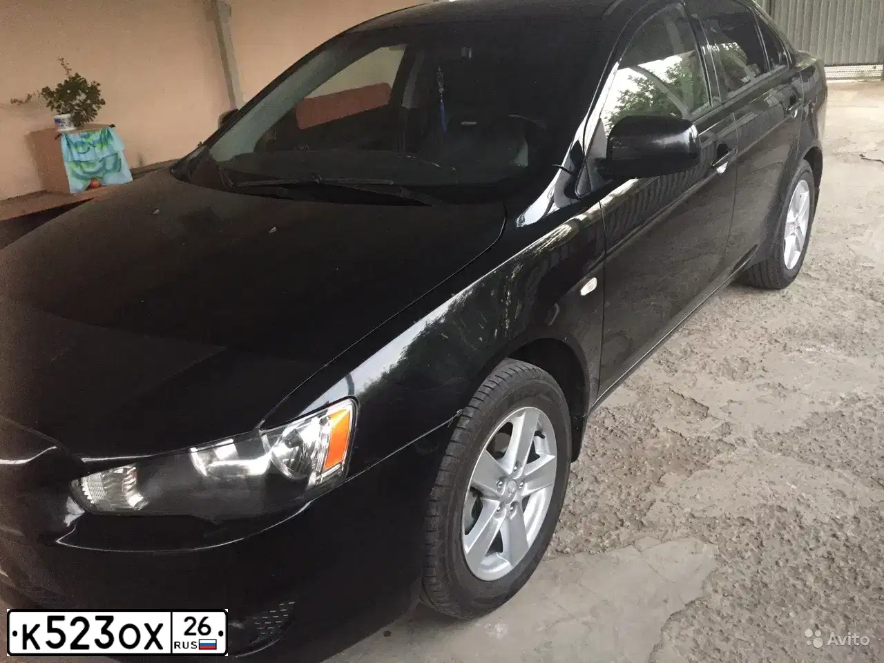 Фото автомобиля MITSUBISHI LANCER, 2008 — госномер К523ОХ26. Цвет: ЧЕРНЫЙ