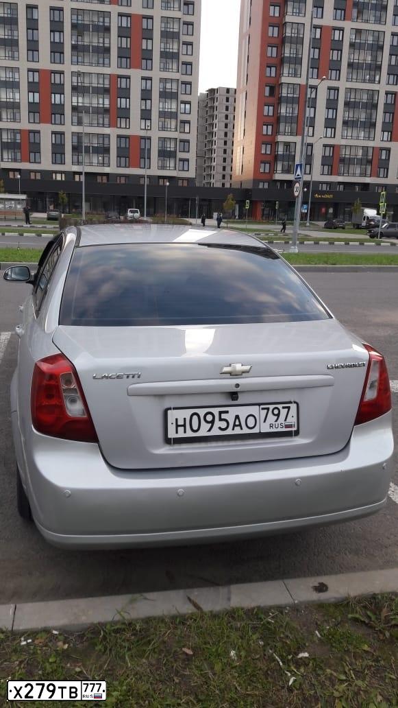 Фото автомобиля CHEVROLET LACETTI, 2009 — госномер Р246ВН40. Цвет: СЕРЫЙ