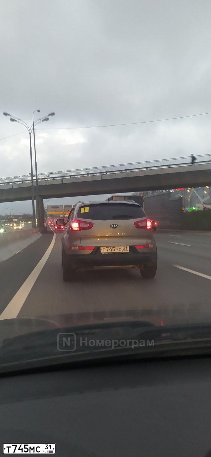 Фото автомобиля KIA SPORTAGE, 2010 — госномер Т745МС31. Цвет: СЕРЫЙ