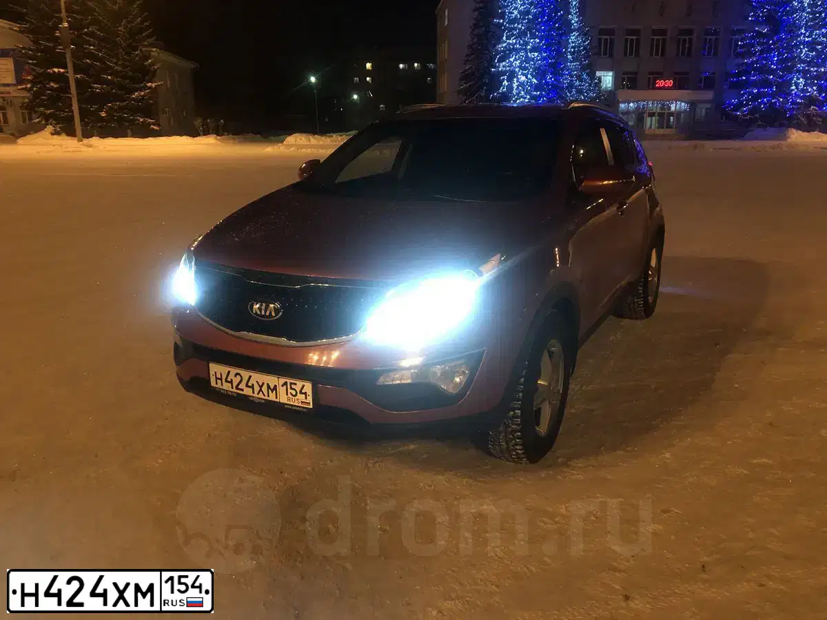 Фото автомобиля KIA SPORTAGE, 2014 — госномер Х411НЕ142. Цвет: Оранжевый