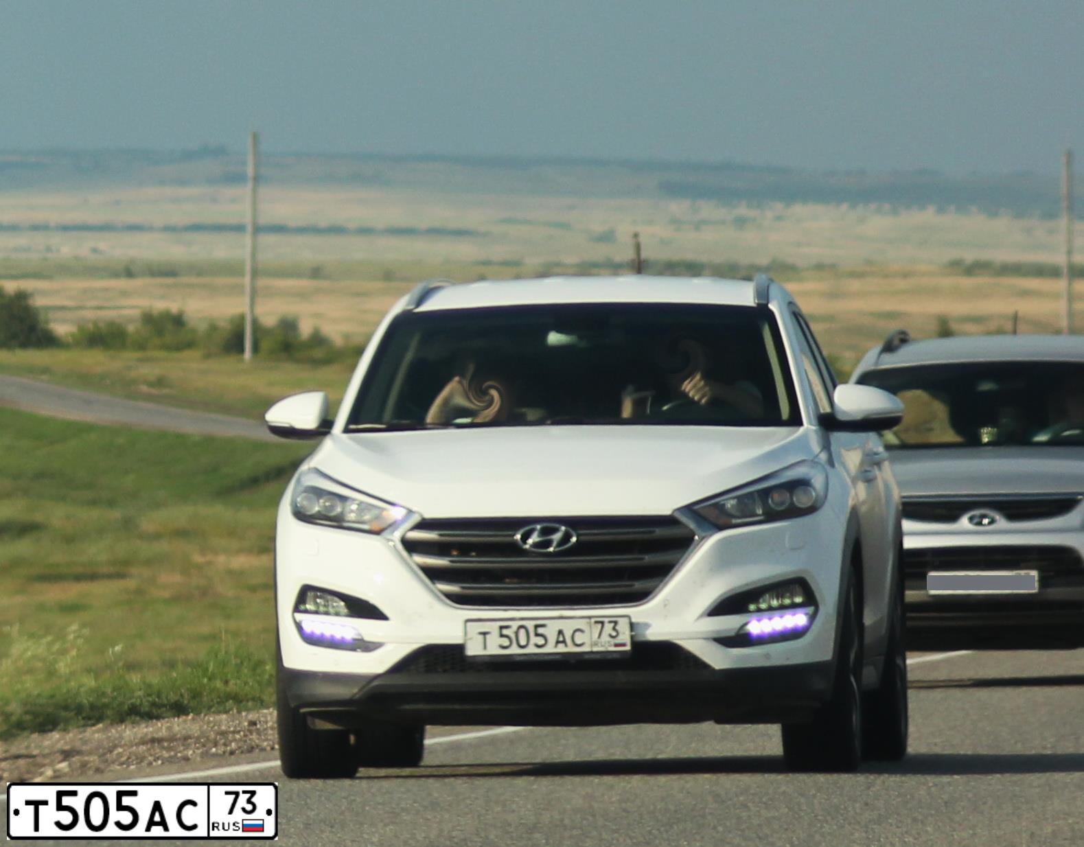 Фото автомобиля HYUNDAI IX35, 2012 — госномер Т505АС73. Цвет: СЕРЫЙ
