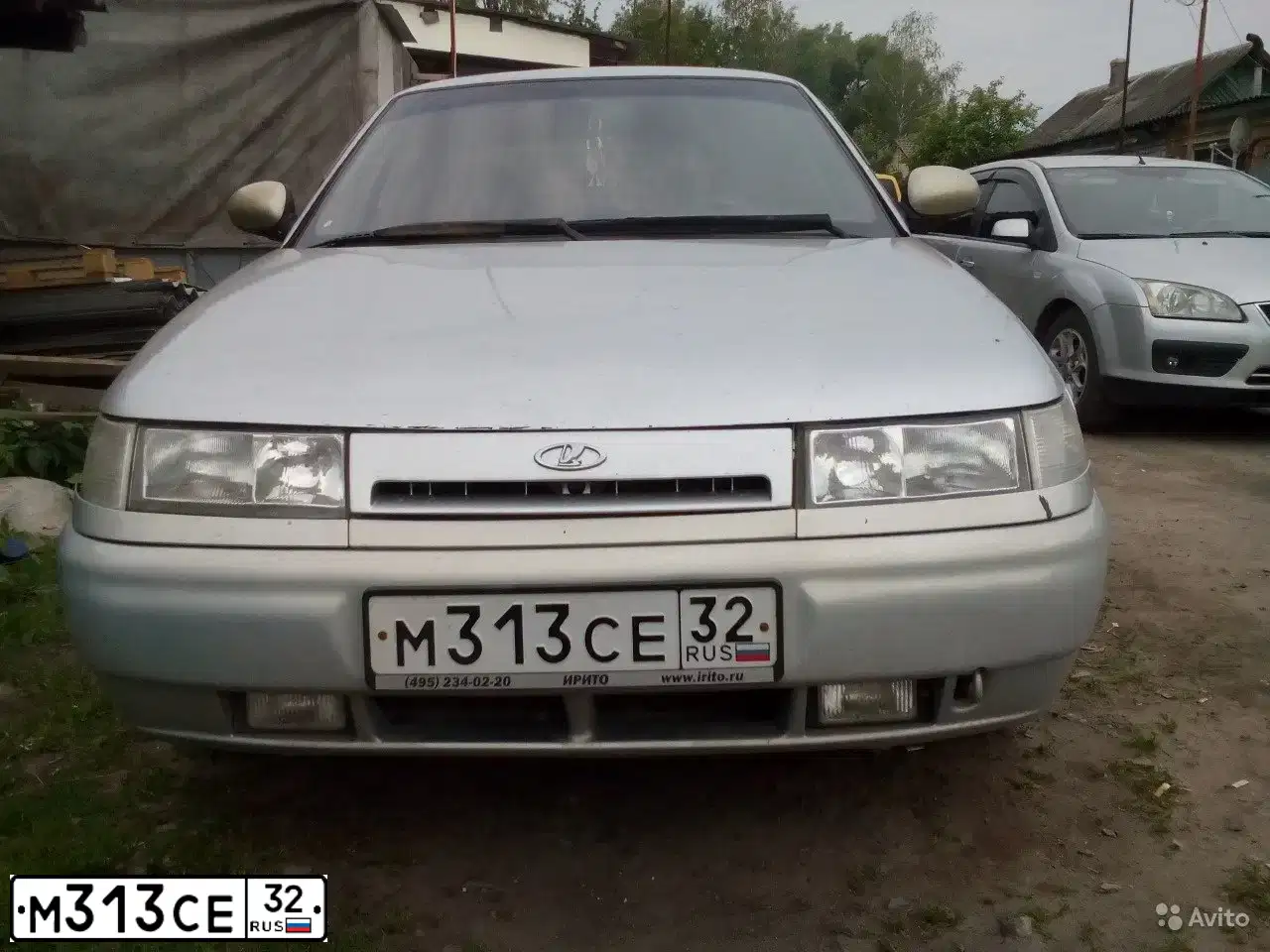 Фото автомобиля LADA 2112, 2004 — госномер Н651ВК32. Цвет: СЕРЫЙ