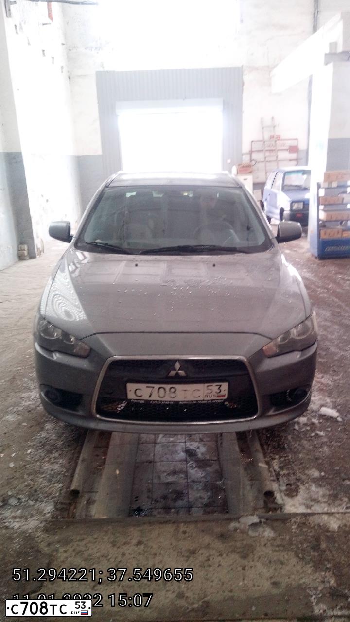 Фото автомобиля MITSUBISHI LANCER, 2012 — госномер Т195ХТ31. Цвет: СЕРЫЙ