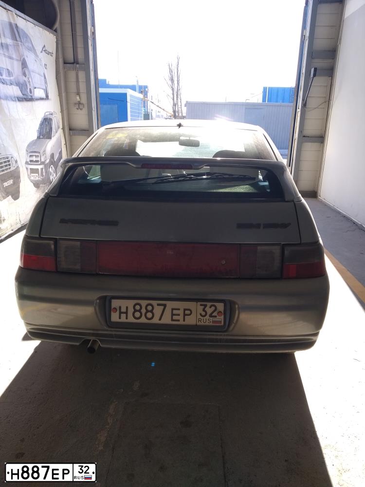 Фото автомобиля LADA 2112, 2006 — госномер С334ЕР57. Цвет: СЕРЫЙ