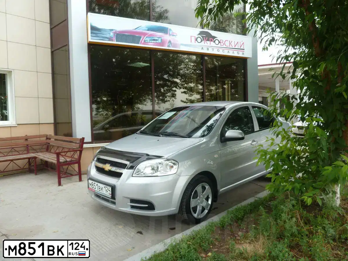 Фото автомобиля CHEVROLET AVEO, 2010 — госномер К133ЕН70. Цвет: СЕРЕБРИСТЫЙ