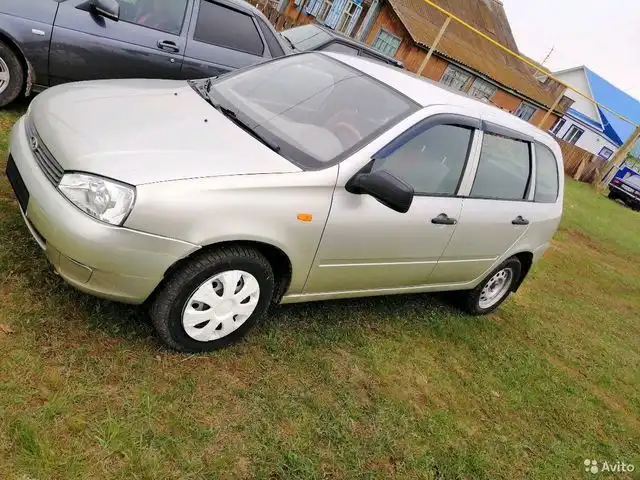 Фото автомобиля LADA 1117 KALINA, 2010 — госномер В657ВС116. Цвет: БЕЛО-ЖЕЛТЫЙ ПЕРЛАМУТР.