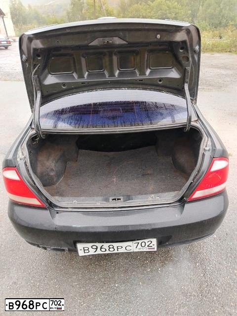Фото автомобиля NISSAN ALMERA CLASSIC 1.6 PE, 2006 — госномер Н683УО702. Цвет: ЧЕРНЫЙ