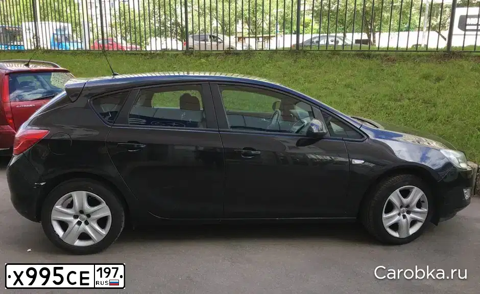 Фото автомобиля OPEL ASTRA, 2011 — госномер Х995СЕ197. Цвет: ЧЕРНЫЙ