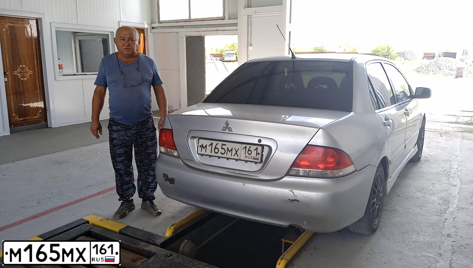 Фото автомобиля MITSUBISHI LANCER, 2004 — госномер М165МХ161. Цвет: СЕРЕБРИСТЫЙ
