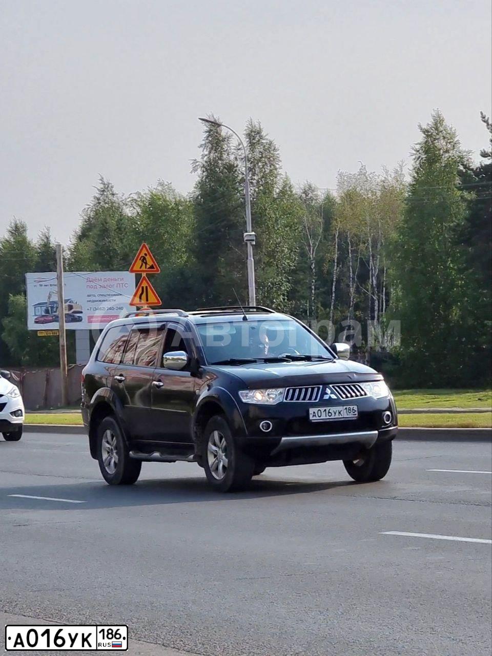 Фото автомобиля MITSUBISHI PAJERO SPORT, 2008 — госномер А016УК186. Цвет: ЧЕРНЫЙ