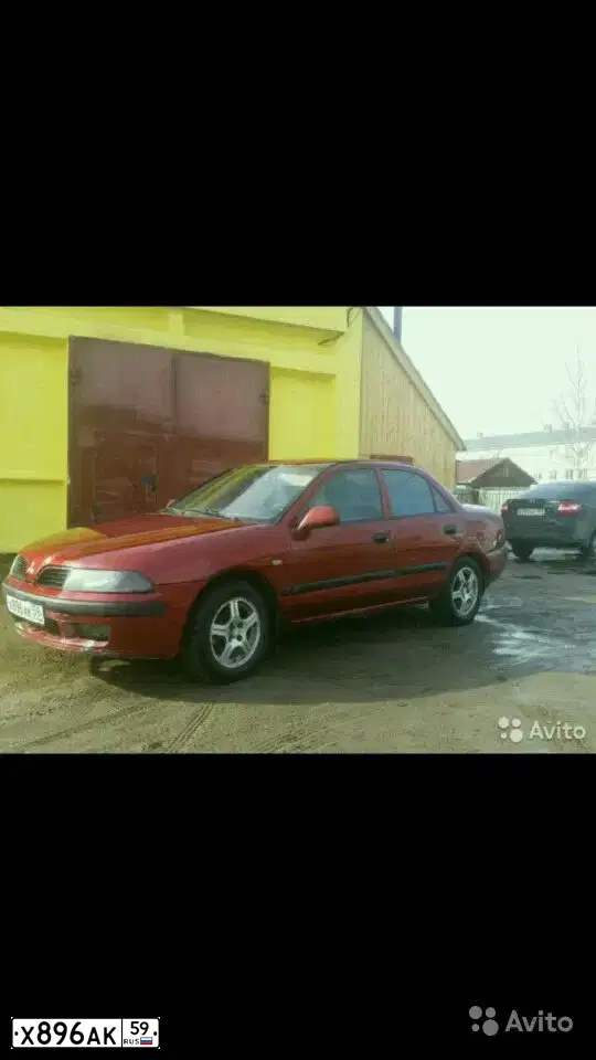 Фото автомобиля MITSUBISHI CARISMA, 2001 — госномер О059ММ159. Цвет: Красный