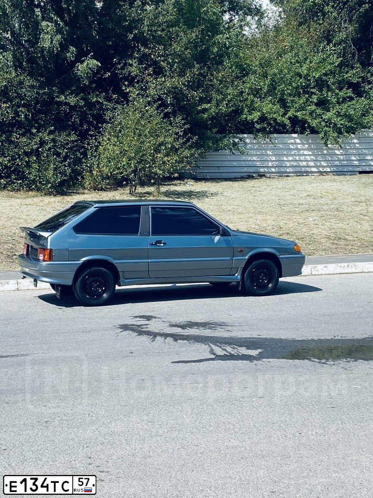 Фото автомобиля LADA 2113 SAMARA, 2011 — госномер Х284СС31. Цвет: СЕРО-ЗЕЛЕНЫЙ