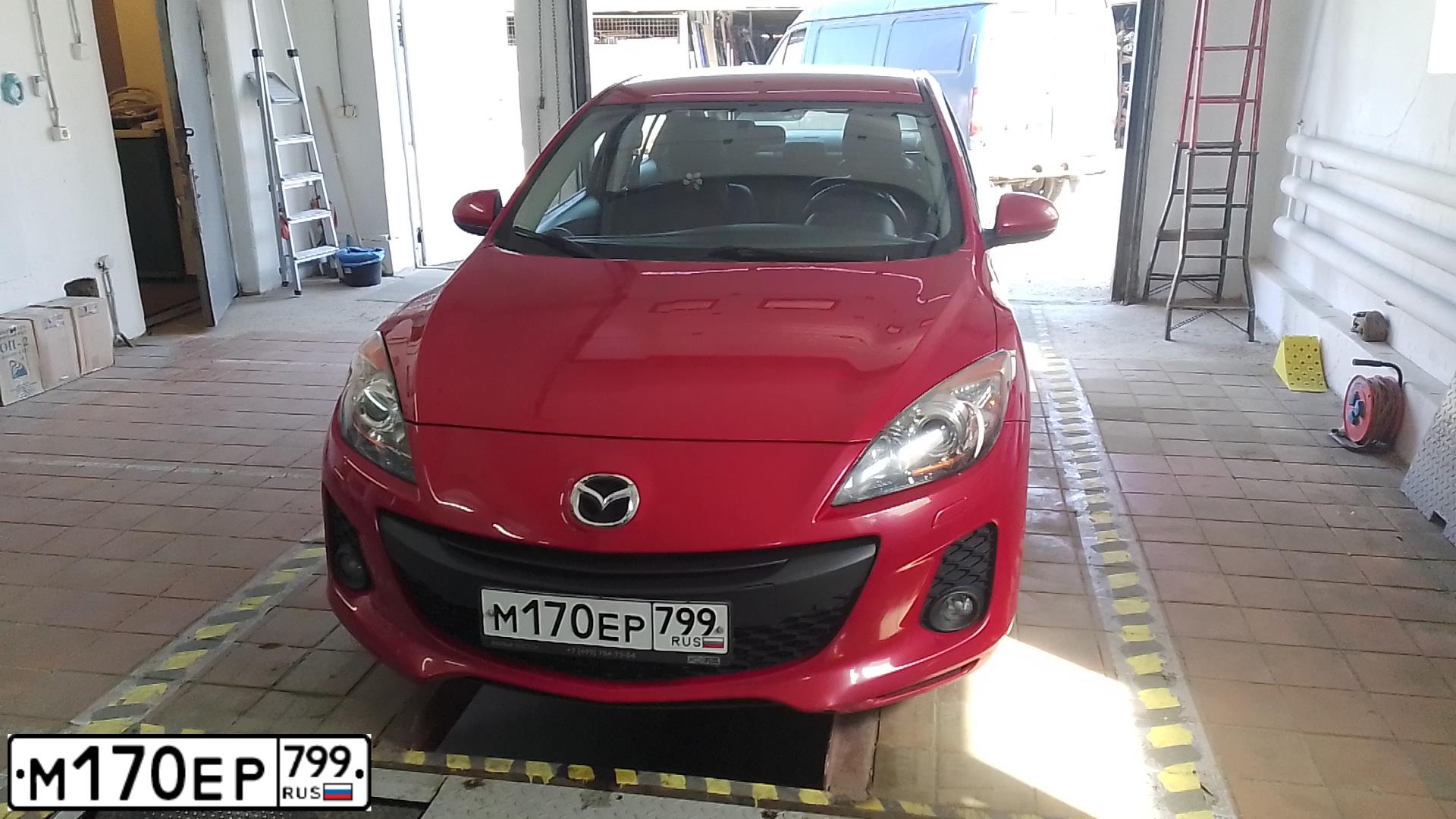 Фото автомобиля MAZDA 3, 2012 — госномер А749ХА190. Цвет: Красный
