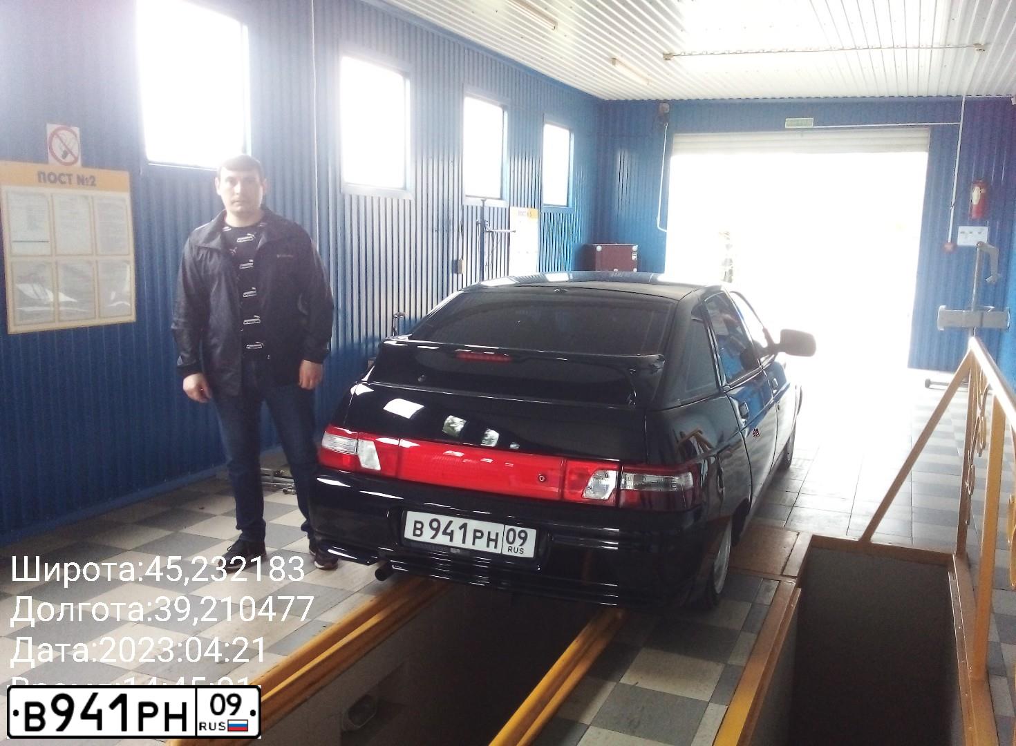 Фото автомобиля LADA 2112, 2001 — госномер В911РК09. Цвет: ЧЕРНЫЙ