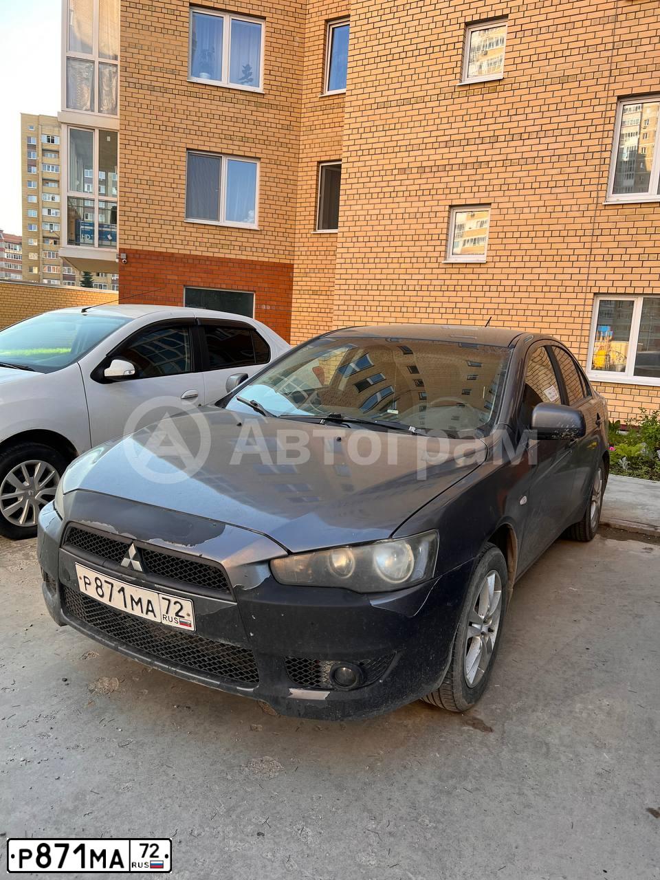 Фото автомобиля MITSUBISHI LANCER, 2007 — госномер Р871МА72. Цвет: СЕРЫЙ
