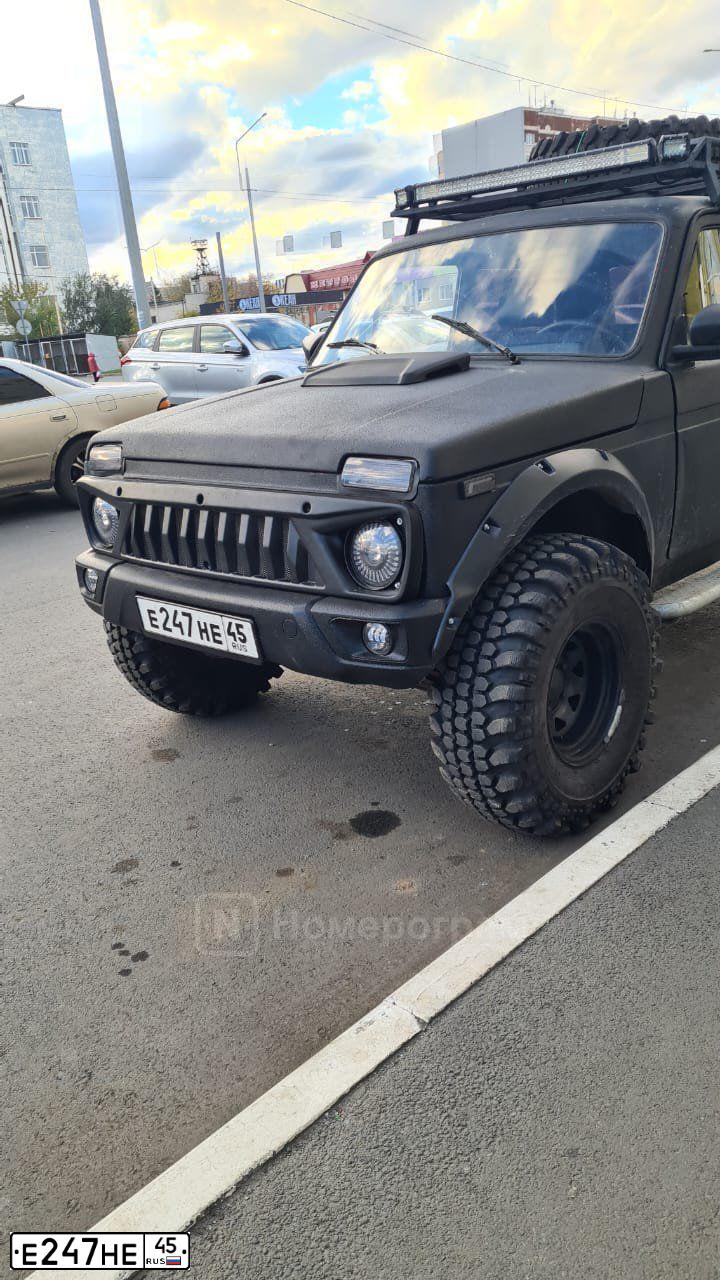 Фото автомобиля LADA 2121 NIVA, 1997 — госномер Е247НЕ45. Цвет: ЧЕРНЫЙ