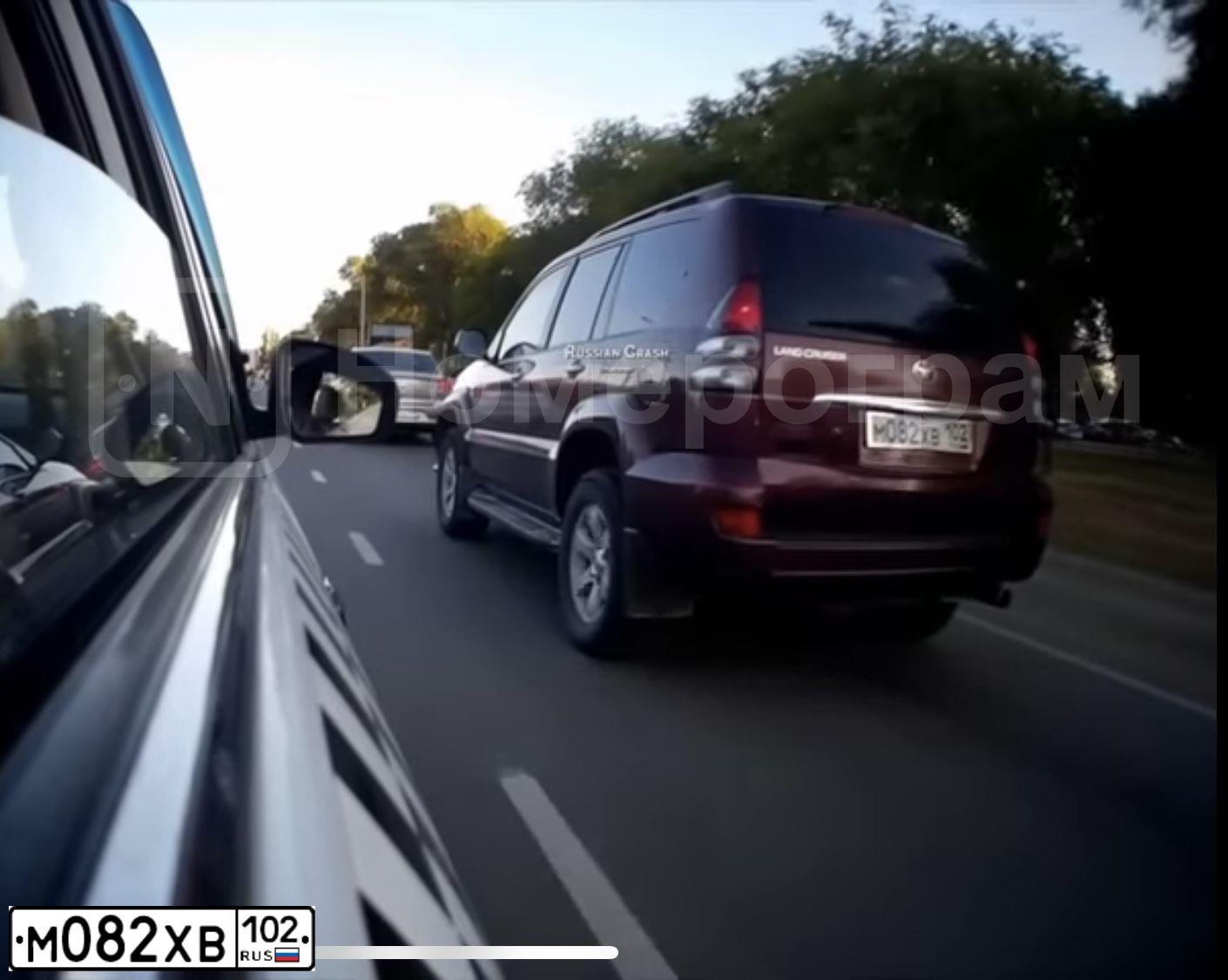 Фото автомобиля TOYOTA LAND CRUISER 120, 2007 — госномер О943ВХ702. Цвет: ТЕМНО-КРАСНЫЙ