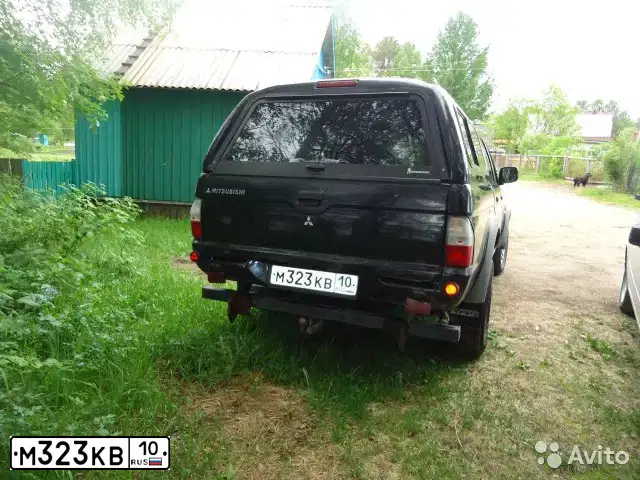 Фото автомобиля MITSUBISHI L 200, 2006 — госномер М657НО10. Цвет: ЧЕРНЫЙ