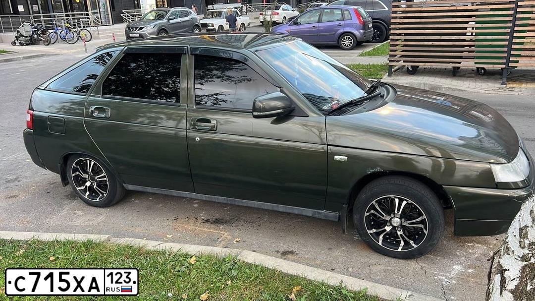 Фото автомобиля LADA 2112, 2006 — госномер К708ЕС180. Цвет: ЗОЛОТИСТЫЙ ТЕМНО-ЗЕЛЕНЫЙ